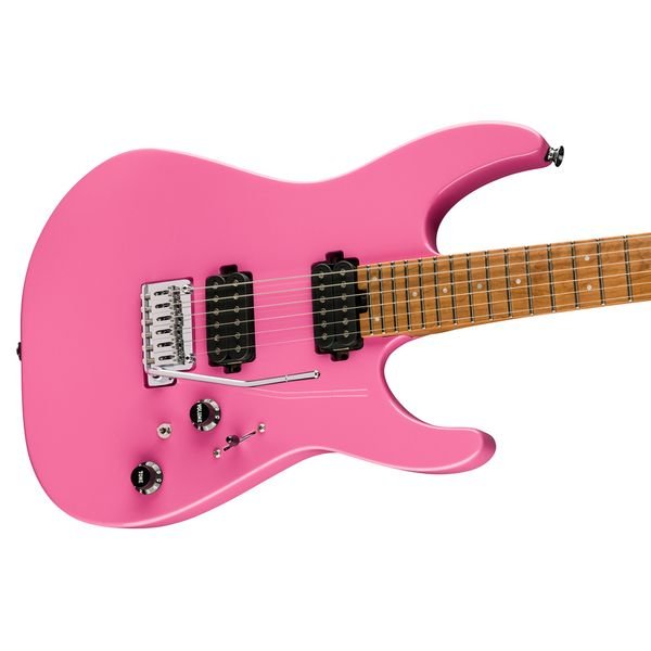 sife view of charvel pink guitar with black pickups