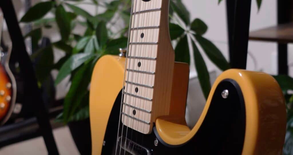 closeup of fretboard and strings